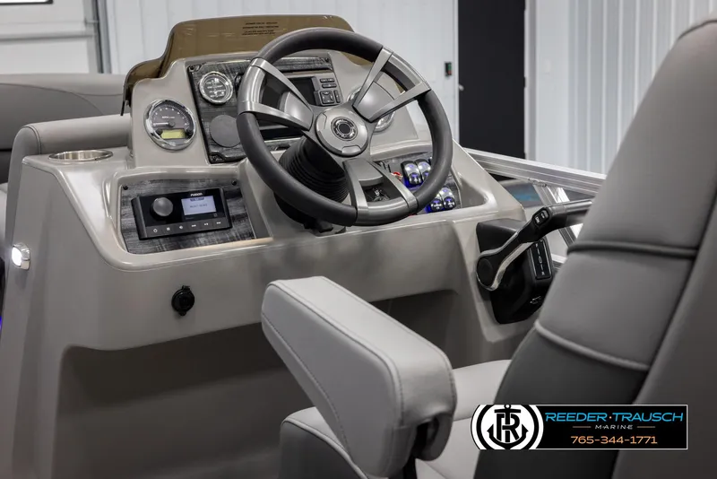 Slide: The Image of Interior view of 2025 Avalon VLS QL boat dashboard with steering wheel and controls. - 27