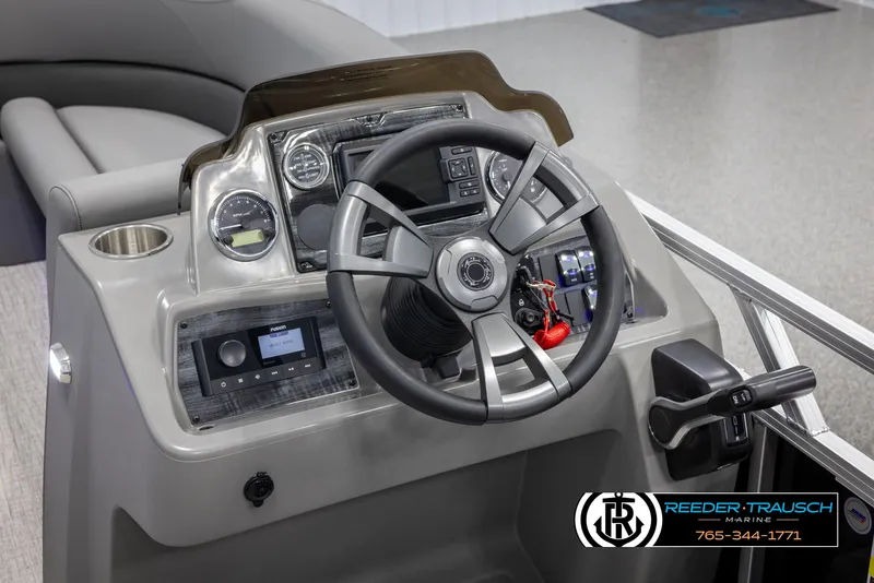 Slide: The Image of 2025 Avalon VLS QL boat dashboard with steering wheel and control panel. - 28