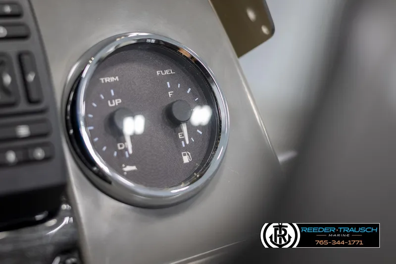 Slide: The Image of Close-up of Avalon VLS QL 2025 dashboard gauge showing trim and fuel levels. - 34