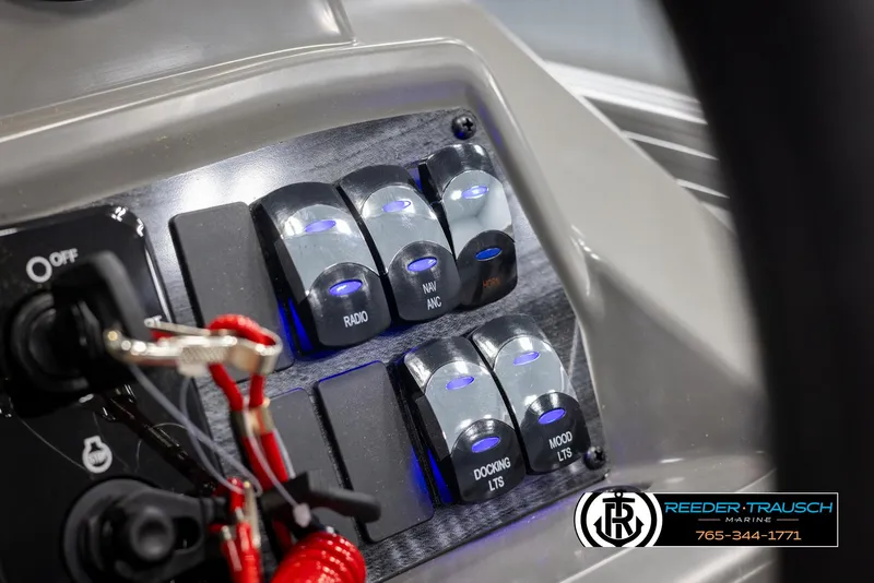 Slide: The Image of Control panel of 2025 Avalon VLS QL boat with labeled switches and key tether. - 35
