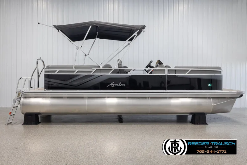 Slide: The Image of 2025 Avalon VLS QL pontoon boat with canopy in showroom. - 6