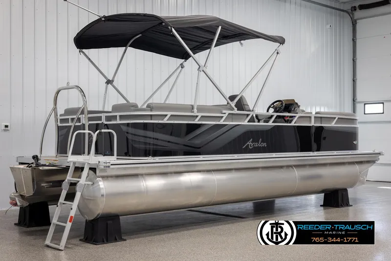 Slide: The Image of 2025 Avalon VLS QL pontoon boat with canopy in showroom. - 7