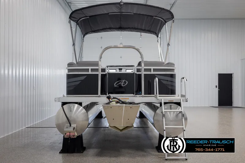 Slide: The Image of 2025 Avalon VLS QL pontoon boat with canopy in a showroom. - 8