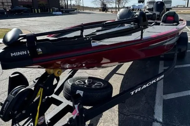 Slide: The Image of 2025 Tracker Savage 215 boat on trailer in parking lot. - 12