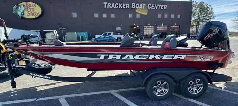 Slide: The Image of 2025 Tracker Savage 215 boat at Tracker Boat Center, red and black design. - 4