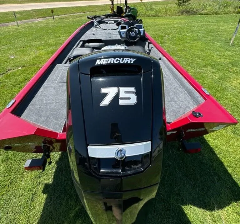 Slide: The Image of 2025 Tracker Savage 215 boat with Mercury 75 engine on grass. - 8