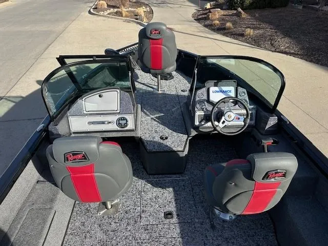 Slide: The Image of 2025 Ranger VS1882SC Angler boat interior with red and gray seating, steering console, and windshield. - 7