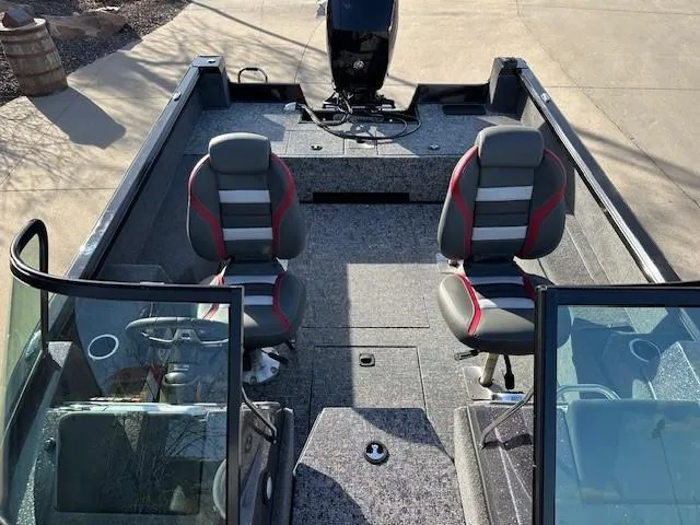 Slide: The Image of 2025 Ranger VS1882SC Angler boat interior with two seats and motor. - 8