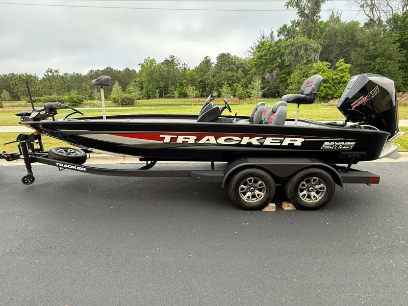 The Image of 2025 Tracker Savage 215 boat on trailer, parked outdoors, side view. - 0
