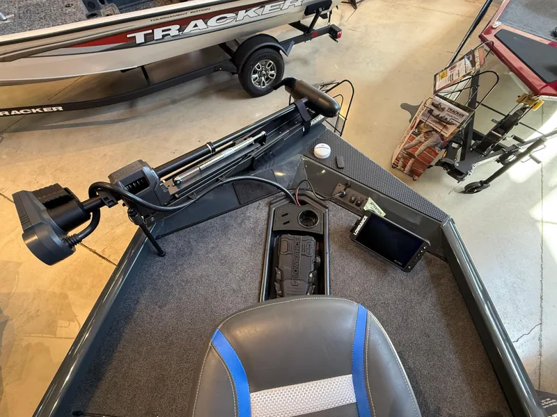 Slide: The Image of 2025 Ranger RT178 boat interior with fishing equipment and seating. - 2