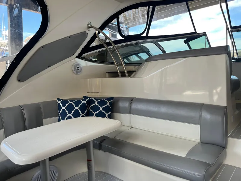 Slide: The Image of 2007 Cruisers Yachts 460 Express interior with seating and table, featuring modern design elements. - 13