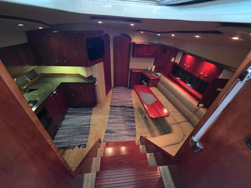 Slide: The Image of Luxurious interior of 2007 Cruisers Yachts 460 Express with elegant wood finishes. - 18