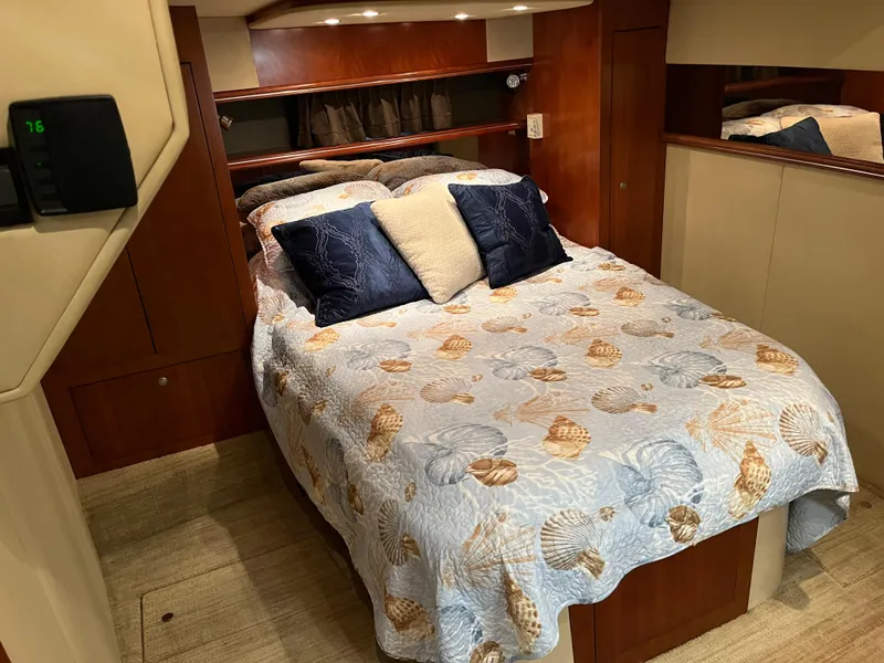 Slide: The Image of Luxurious 2007 Cruisers Yachts 460 Express cabin with cozy bed and elegant decor. - 25