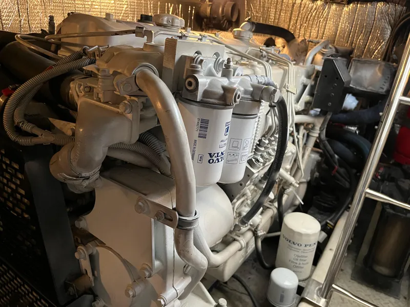 Slide: The Image of Engine room of 2007 Cruisers Yachts 460 Express, showcasing detailed mechanical components. - 29