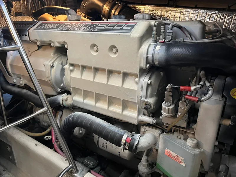 Slide: The Image of Engine compartment of a 2007 Cruisers Yachts 460 Express, showcasing detailed machinery. - 30