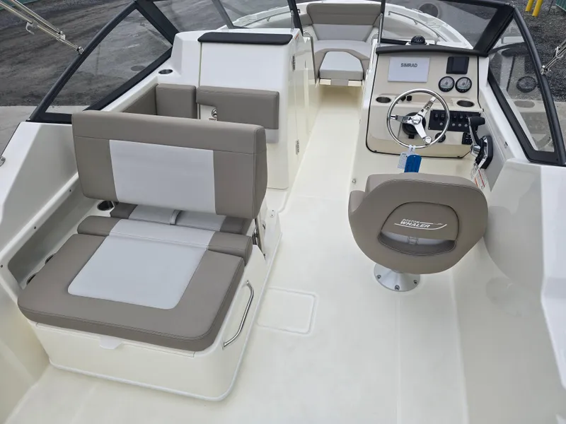 Slide: The Image of 2025 Boston Whaler 210 Vantage boat interior with seating and helm. - 10