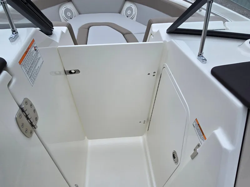 Slide: The Image of 2025 Boston Whaler 210 Vantage boat interior with storage compartments and seating area. - 20