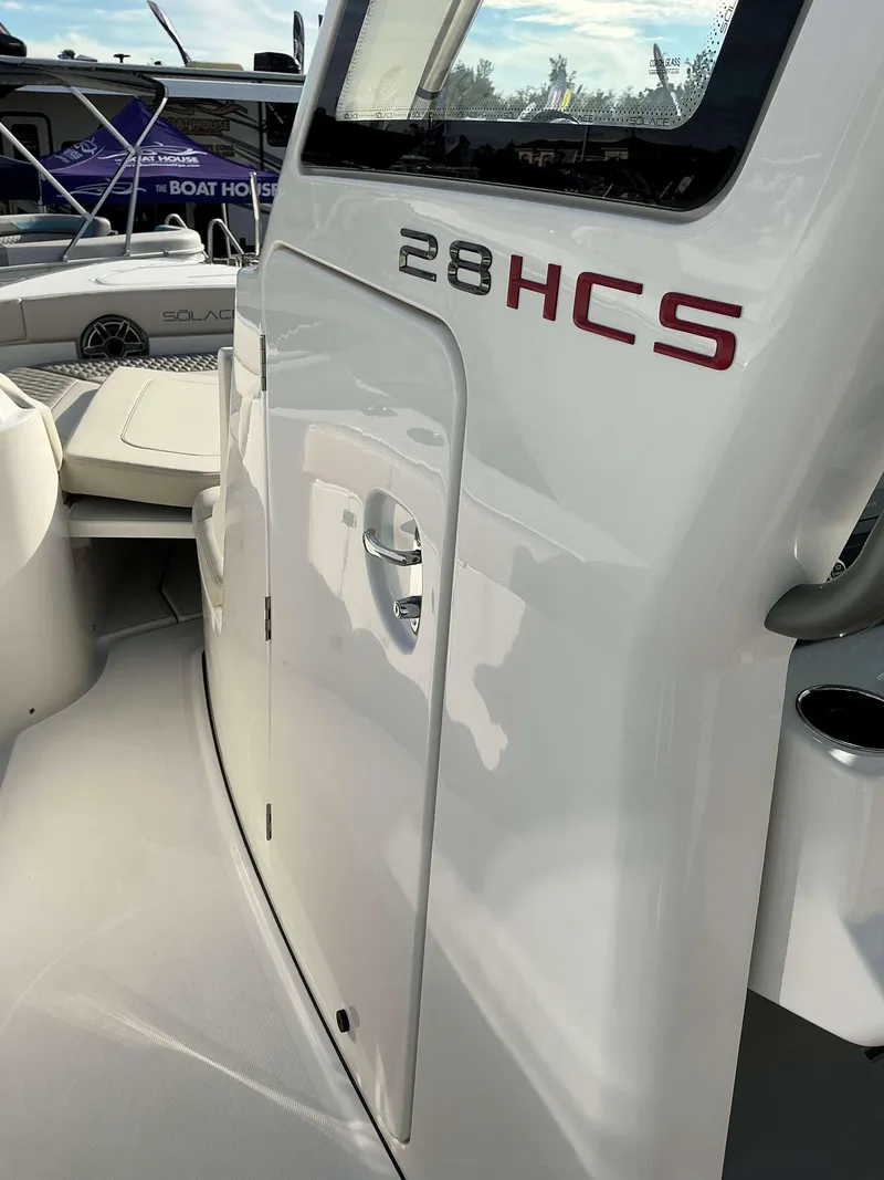 Slide: The Image of 2025 Solace 28 HCS boat interior, showcasing sleek design and modern features. - 13
