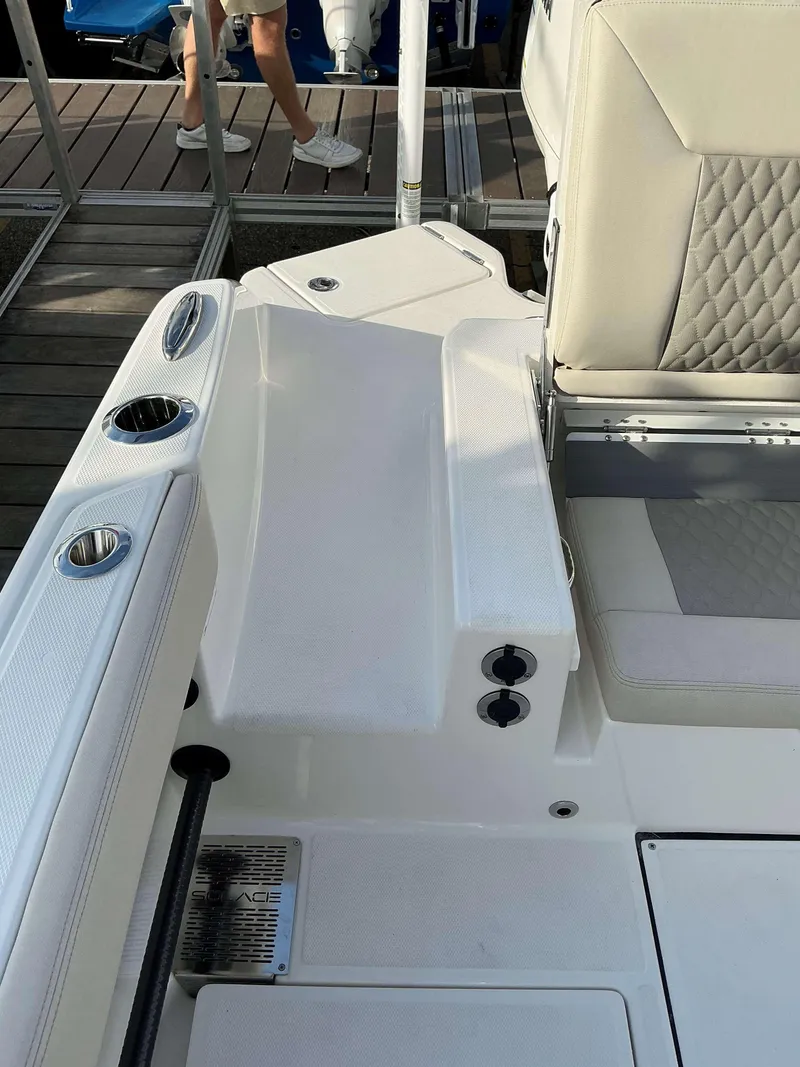 Slide: The Image of 2025 Solace 28 HCS boat interior with seating and cup holders. - 15