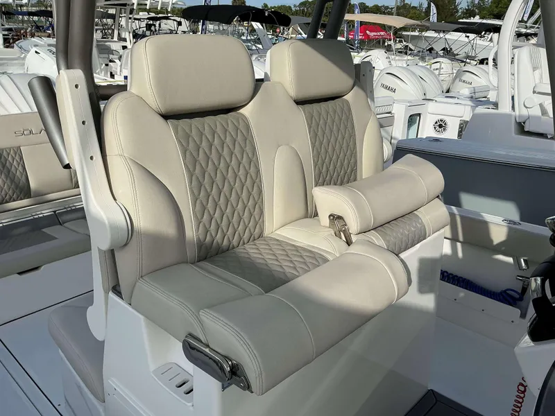 Slide: The Image of Luxurious seating on 2025 Solace 28 HCS boat, featuring elegant quilted upholstery. - 16