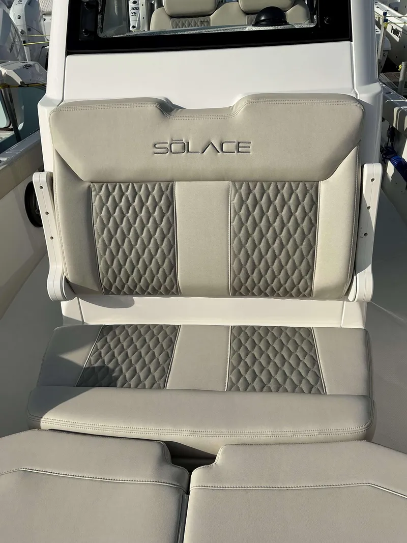 Slide: The Image of 2025 Solace 28 HCS boat seat with quilted upholstery and logo. - 7