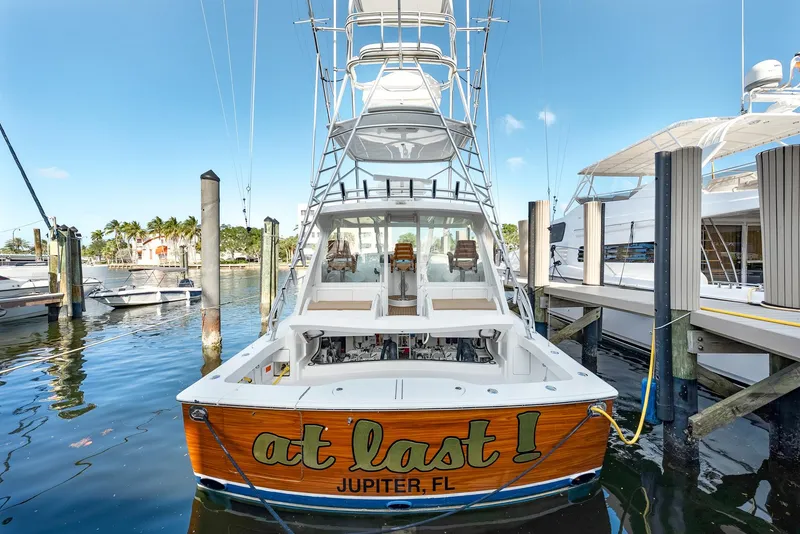 Slide: The Image of 2014 Viking Sport Tower yacht docked, named "At Last" from Jupiter, FL. - 6