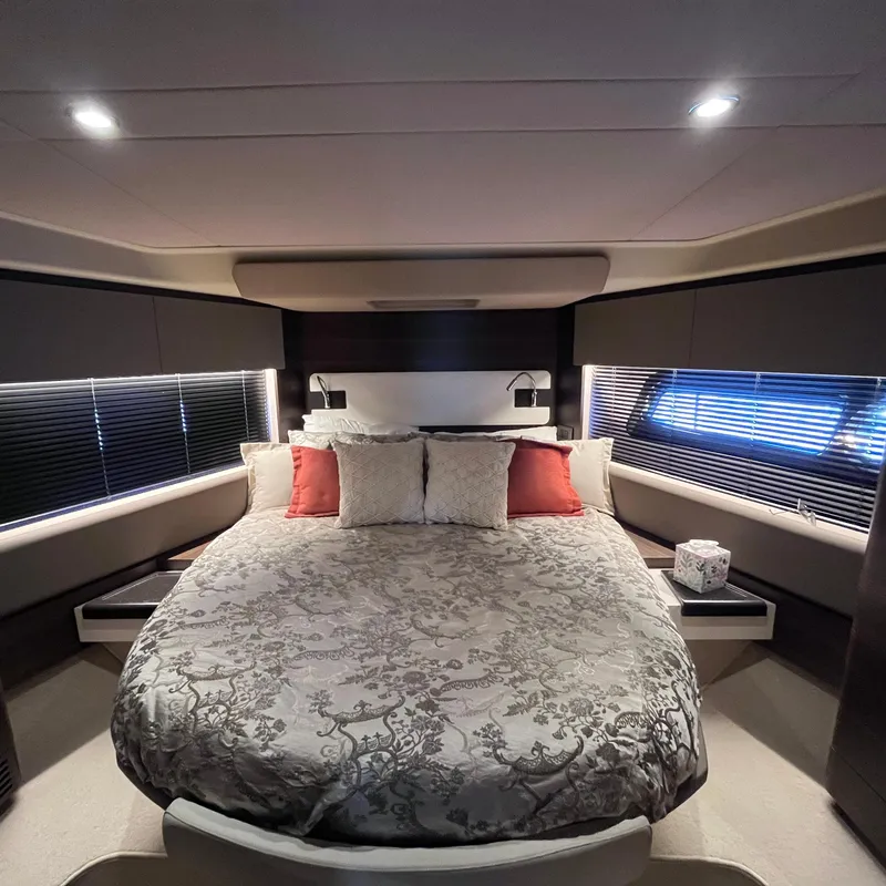 Slide: The Image of Luxurious bedroom interior of 2015 Azimut 50 Fly yacht with elegant bedding and ambient lighting. - 24