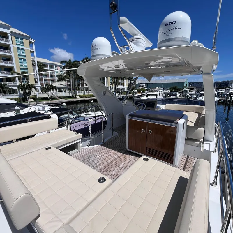 Slide: The Image of Azimut 50 Fly 2015 yacht interior with seating and navigation equipment at marina. - 27