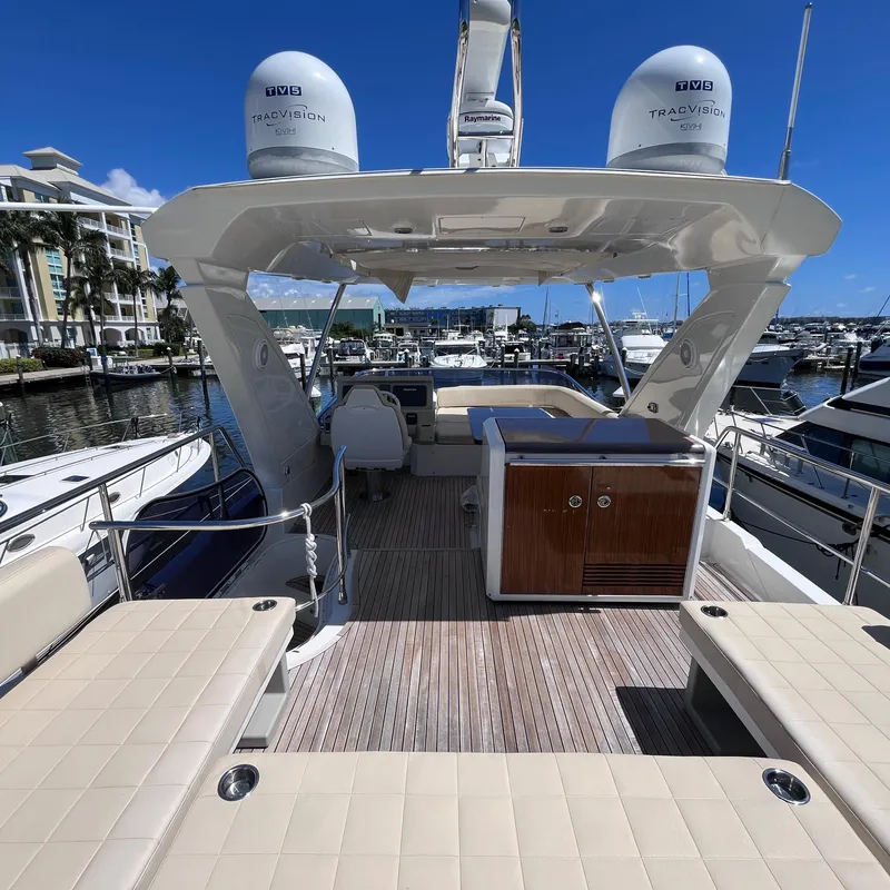 Slide: The Image of Azimut 50 Fly 2015 yacht interior with seating and marina view. - 28