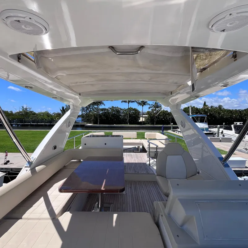 Slide: The Image of Interior view of 2015 Azimut 50 Fly yacht with seating and table. - 29