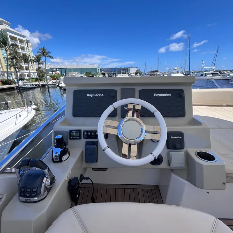 Slide: The Image of Helm of 2015 Azimut 50 Fly yacht with Raymarine navigation, docked in marina. - 31