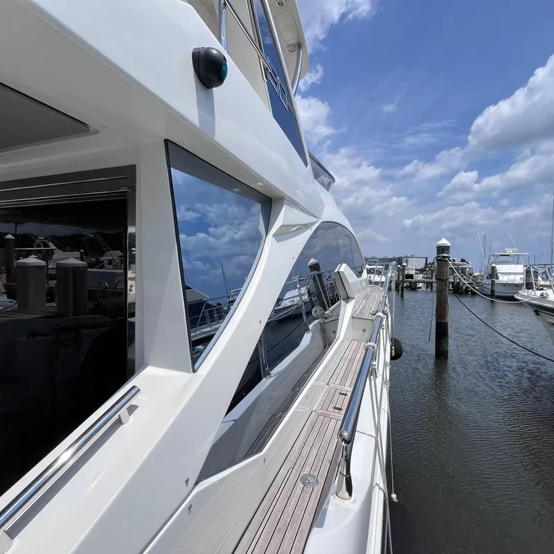 Slide: The Image of Azimut 50 Fly 2015 yacht docked at marina under blue sky. - 5