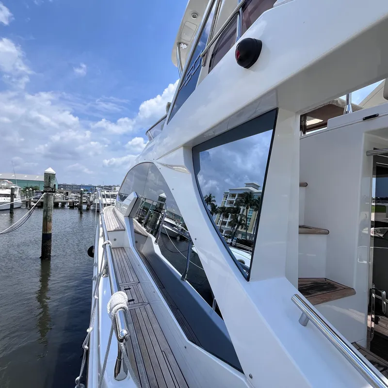 Slide: The Image of Azimut 50 Fly 2015 yacht docked at marina, showcasing sleek design and luxurious features. - 6