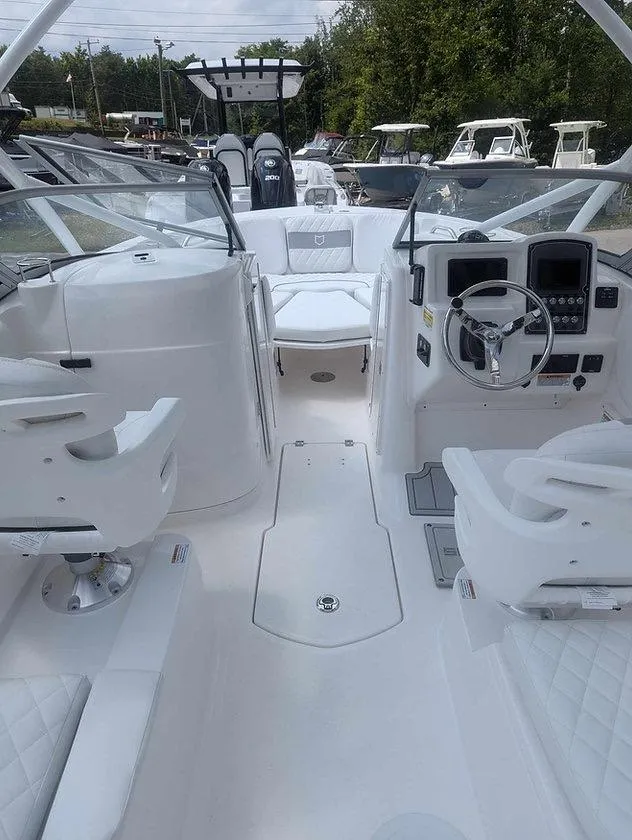 Slide: The Image of 2025 Sea Fox 228 Traveler boat interior with white seating and modern dashboard. - 10