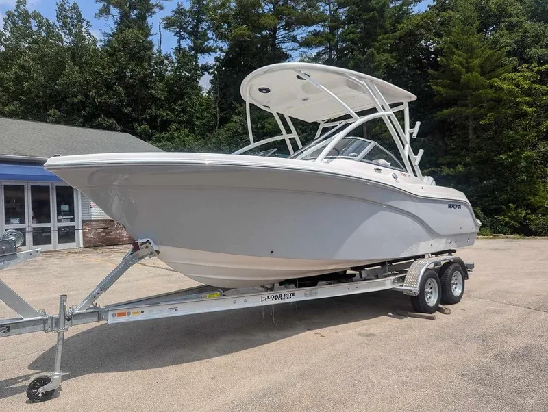 Slide: The Image of 2025 Sea Fox 228 Traveler boat on trailer, parked outdoors. - 2