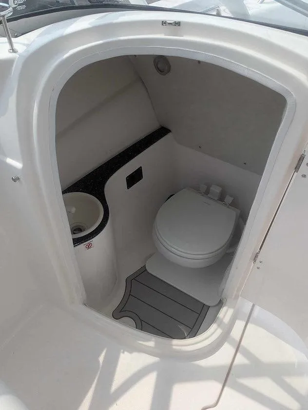 Slide: The Image of 2025 Sea Fox 228 Traveler boat interior with compact marine toilet and sink. - 3