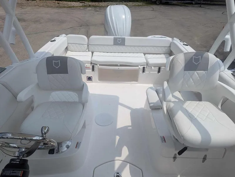 Slide: The Image of 2025 Sea Fox 228 Traveler boat interior with white seating and modern design. - 8