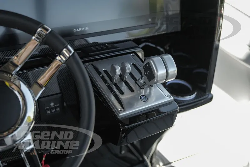 Slide: The Image of 2025 Nor-Tech 340 Sport dashboard with Garmin display and joystick controls. - 13