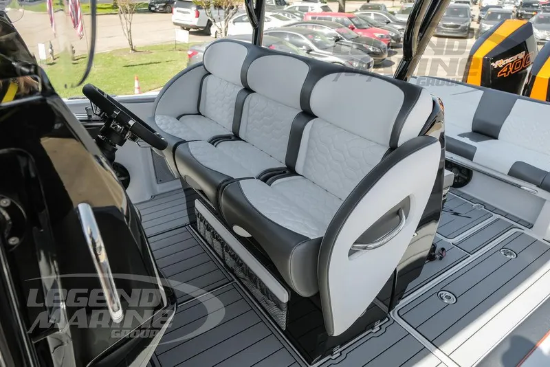 Slide: The Image of Garmin display on 2025 Nor-Tech 340 Sport boat dashboard, featuring modern controls. - 19