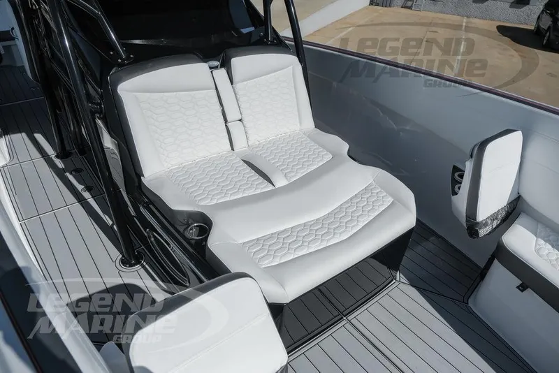 Slide: The Image of 2025 Nor-Tech 340 Sport boat interior with luxurious seating and modern design. - 32