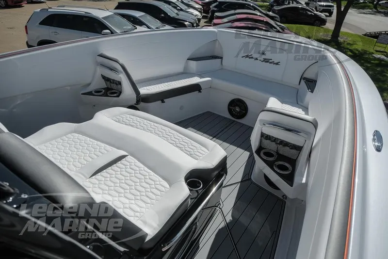 Slide: The Image of 2025 Nor-Tech 340 Sport boat console with sleek black design and advanced features. - 33