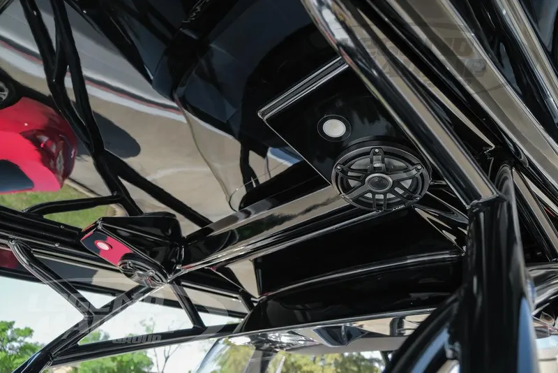 Slide: The Image of 2025 Nor-Tech 340 Sport dashboard with JL Audio system and carbon fiber finish. - 35