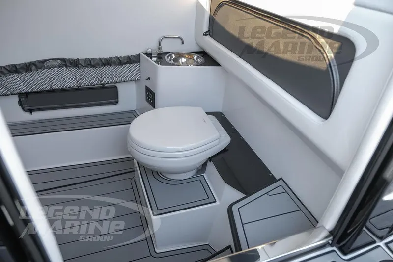 Slide: The Image of Control panel inside 2025 Nor-Tech 340 Sport boat cabin, featuring Legend Marine Group branding. - 47