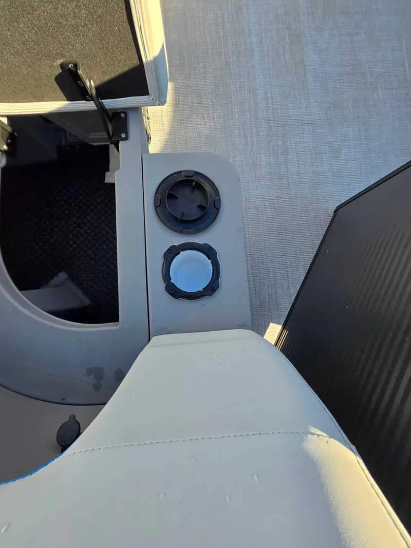 Slide: The Image of Interior of 2025 Qwest E-CLASS 22 XRE CRUISE with cup holders and seating. - 11