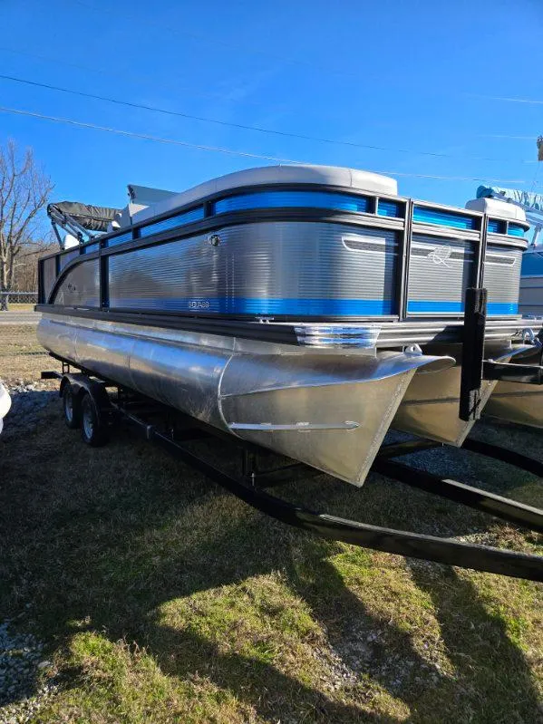 Slide: The Image of 2025 Qwest E-CLASS 22 XRE CRUISE pontoon boat on trailer, sunny day. - 3