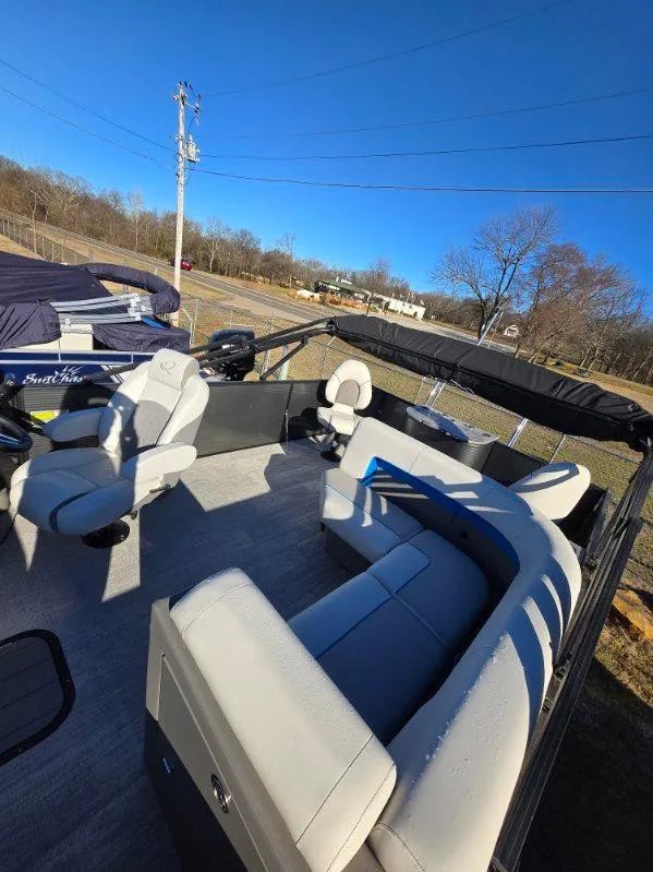 Slide: The Image of 2025 Qwest E-CLASS 22 XRE CRUISE pontoon boat interior with seating and steering console. - 5