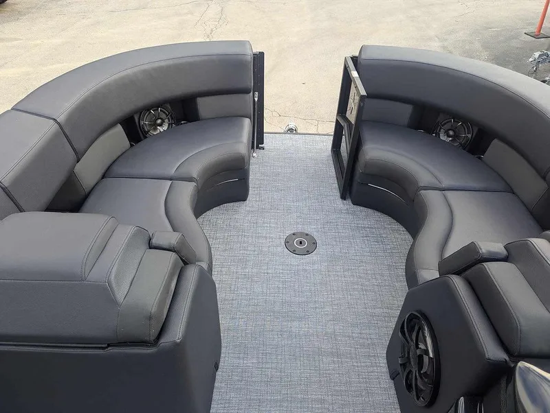 Slide: The Image of 2025 Berkshire 23ULE boat interior with curved seating and modern design. - 4