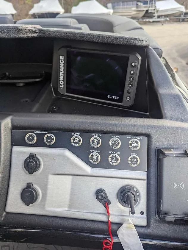 Slide: The Image of Control panel of 2025 Berkshire 23ULE boat with Lowrance Elite display. - 5