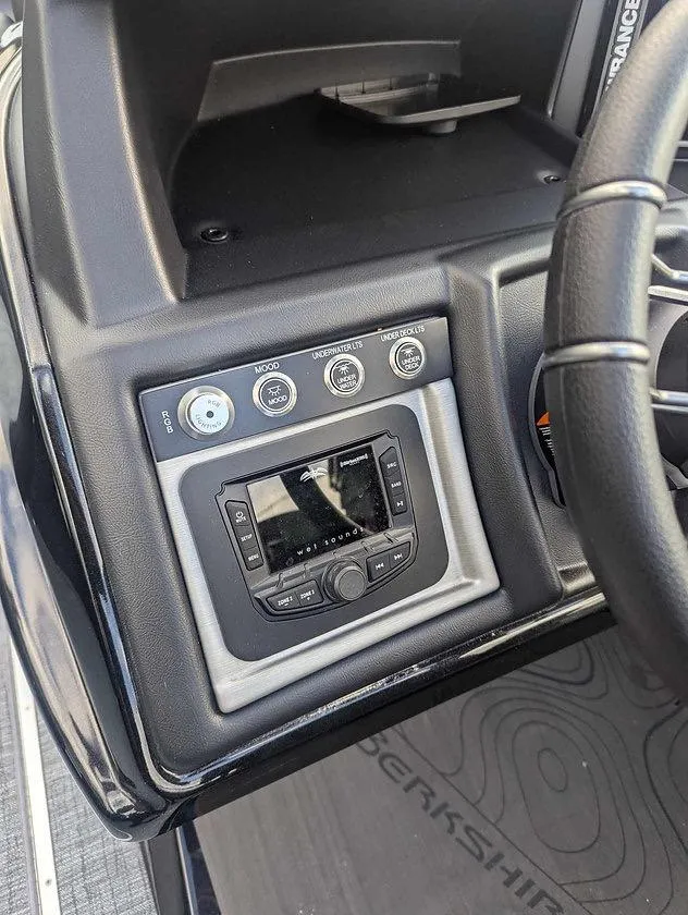 Slide: The Image of 2025 Berkshire 23ULE dashboard with control panel and steering wheel. - 6