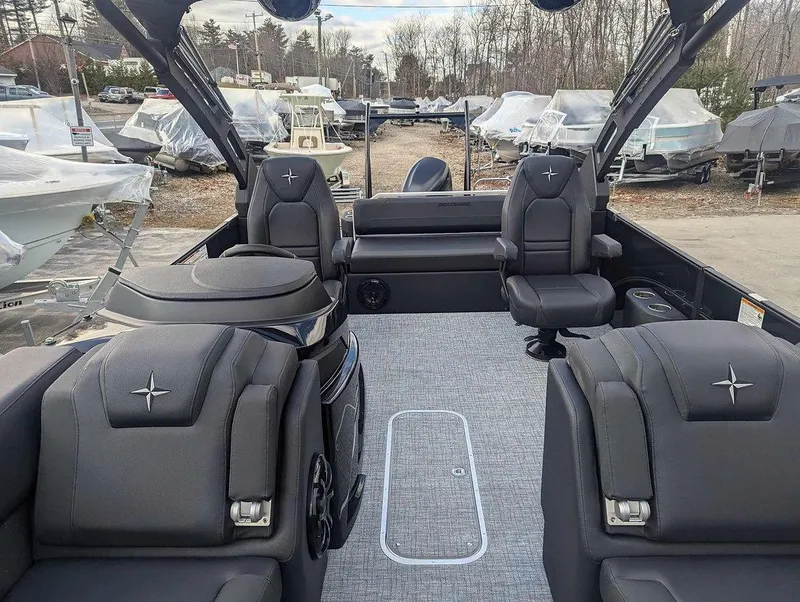 Slide: The Image of 2025 Berkshire 23ULE pontoon boat interior with plush seating and modern design. - 9